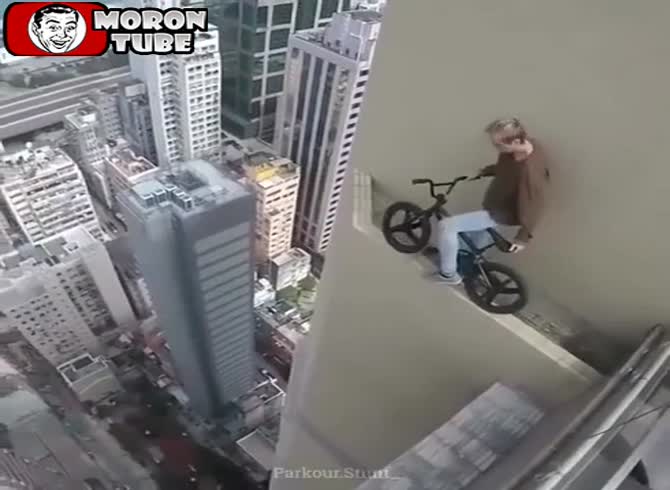 Video :On top of a tower, this guy rides his bike